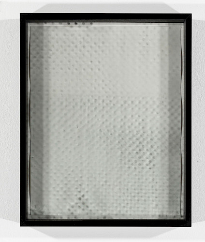 <i>Dot Dots #2</i>, 2023/24<br />
<em>Museum glass coated with photo emulsion, exposed with negative of the Polkadots series,<br />
Photogram on baryta paper</em><br />
28 x 23 x 4 cm