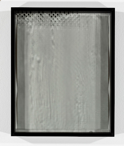 <i>Dot Dots #23</i>, 2023/24<br />
<em>Museum glass coated with photo emulsion, exposed with negative of the Polkadots series,<br />
Photogram on baryta paper</em><br />
28 x 23 x 4 cm