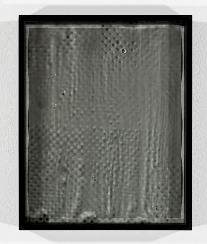 <i>Dot Dots #8</i>, 2023/24<br />
<em>Museum glass coated with photo emulsion, exposed with negative of the Polkadots series,<br />
Photogram on baryta paper</em><br />
28 x 23 x 4 cm