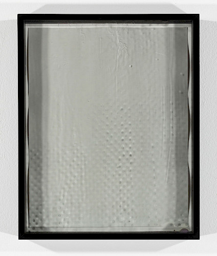 <i>Dot Dots #4</i>, 2023/24<br />
<em>Museum glass coated with photo emulsion, exposed with negative of the Polkadots series,<br />
Photogram on baryta paper</em><br />
28 x 23 x 4 cm